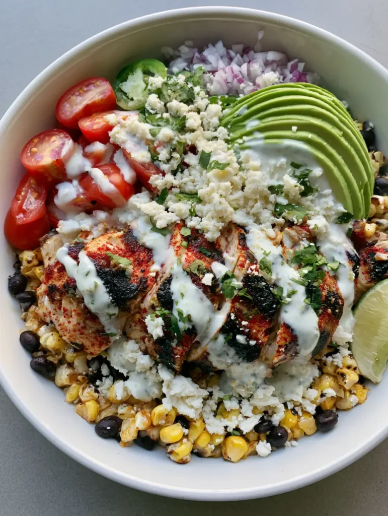 High-Protein Chicken Street Corn Salad: The Ultimate Zesty Meal Prep 1 Bird's eye view of charred sweet corn kernels and black beans topped with cotija and cilantro. (High-Protein Chicken Street Corn Salad)