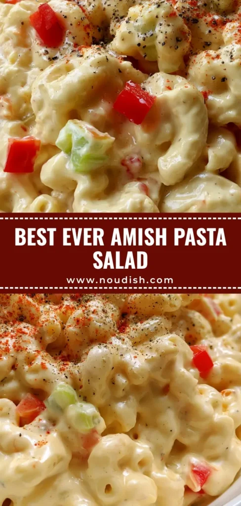 A close-up shot of creamy Amish Pasta Salad in a white bowl garnished with paprika and black pepper.
