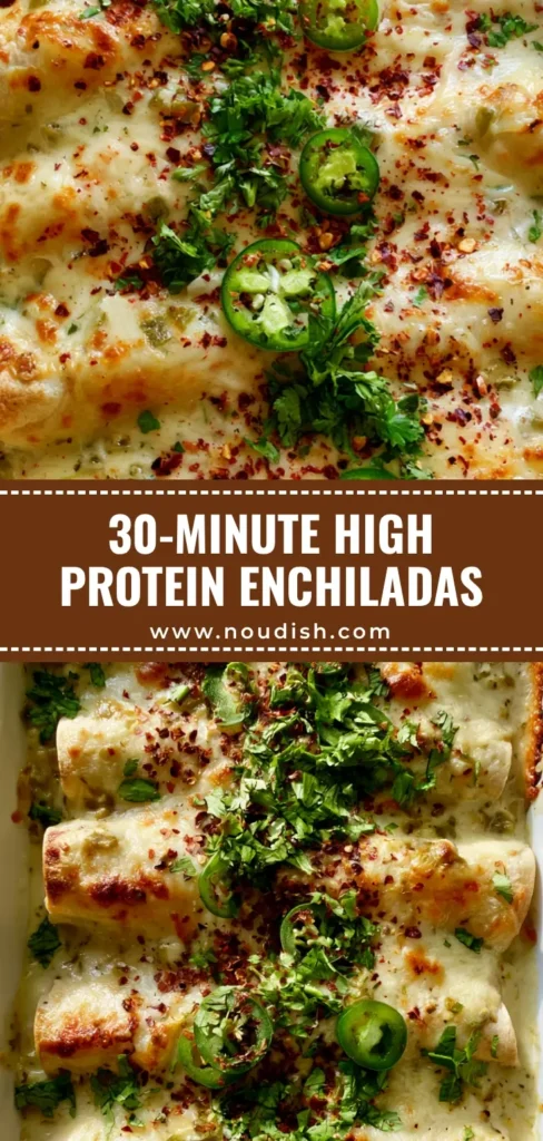 A ceramic baking dish filled with High Protein Chicken Enchiladas smothered in white sauce and bubbly toasted cheese.