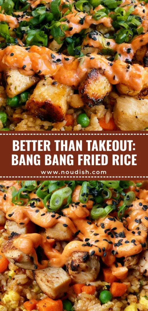 A shallow black bowl filled with Bang Bang Fried Rice featuring seared chicken, peas, carrots, and a messy zigzag drizzle of orange bang bang sauce, garnished with scallions and black sesame seeds.